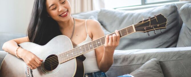 Adult Music Lesson Learner with Guitar