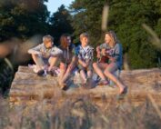 Kids enjoying music outdoors playing guitar